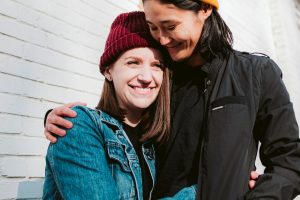 Lesbian couple hugging and happy together after therapy